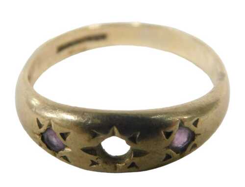 A 9ct gold gypsy ring, the central stone missing, set with two outer amethysts, each star set,...