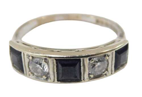 An 18ct white gold sapphire and diamond Art Deco style dress ring, set with three square cut...