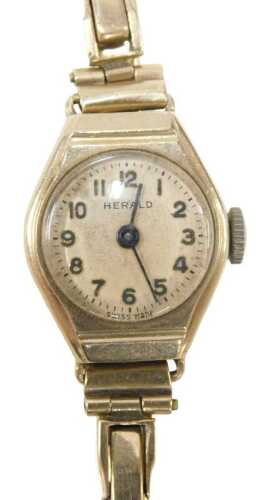A Herald 9ct gold lady's cocktail watch, with a cream numeric dial, on expanding bracelet, 15.4g.