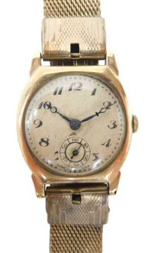 A 9ct gold cased mid 20thC wristwatch, with a cream numeric blue handed dial, with seconds dial...