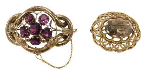 Two brooches, comprising a Victorian pinchbeck brooch, set with amethyst, and raised leaf and...