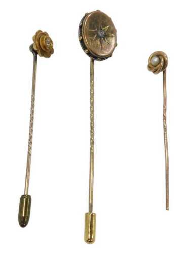 Three stick pins, comprising a diamond chip stick pin, yellow metal, unmarked, a 9ct gold...