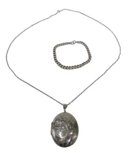 A group of silver jewellery, comprising a silver floral locket, on box link chain, the locket...