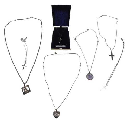 A group of silver chains and pendants, mainly religion related to include St Christopher,...