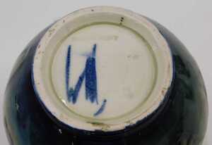 A Moorcroft pottery Anemone pattern vase, of bellied circular form on circular foot, on green... - 2