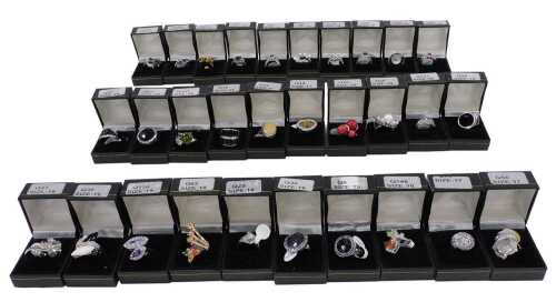 Thirty dress rings, of varying design, mainly stone set, boxed.