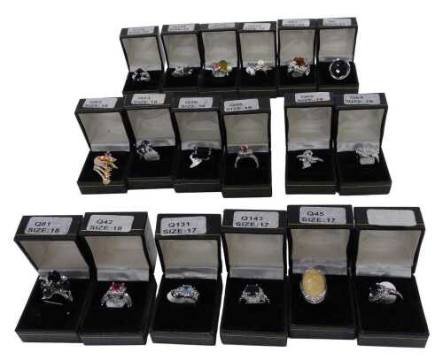 Eighteen costume jewellery dress rings, each stone set, boxed.