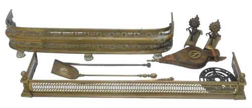 An early 20thC brass D end fire surround, with an upper and lower orb and pierced decoration, on...