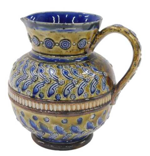 A Doulton stoneware vase, of circular form, with plain spout and raised rosette handle, with a...