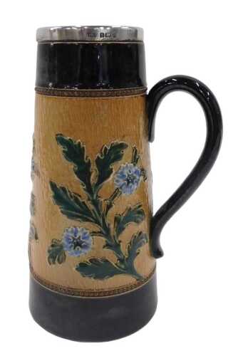A Doulton Lambeth stoneware jug, of tapering circular form, with silver collar, plain ear handle...