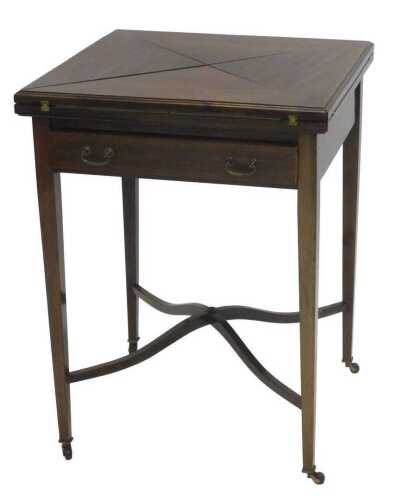 An Edwardian mahogany and boxwood strung envelope table, the square top with a wide crossbanding...