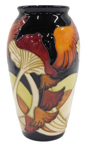 A Moorcroft pottery Parasol Dance pattern shouldered vase, on blue ground, 19cm high.