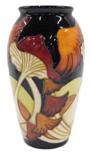 A Moorcroft pottery Parasol Dance pattern shouldered vase, on blue ground, 19cm high.