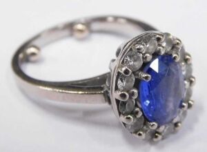 A sapphire and diamond dress ring, with central oval cut cornflower blue sapphire, 8.4mm x 6.2mm... - 3