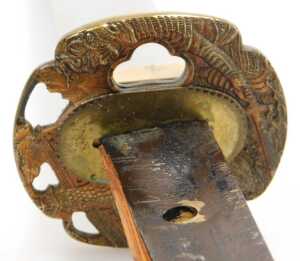 A 20thC Japanese Tanto, the tsuka wrapped in ray skin, and bound with cord, the copper habaki... - 10