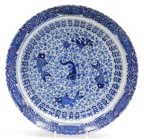 A Chinese Qing Dynasty blue and white five porcelain fishes dish, decorated with fish within...