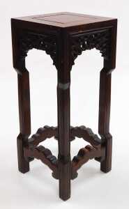 A small Chinese hardwood urn stand, of square section, with scrolling fretwork raised on square...