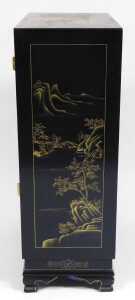 A Chinese lacquered cabinet, gilt decorated with river landscapes, having two doors opening to... - 3