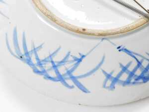 A Chinese Qing Dynasty blue and white porcelain charger, decorated with vases and urns of... - 5