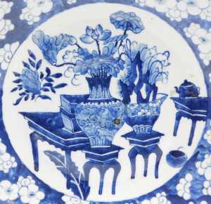 A Chinese Qing Dynasty blue and white porcelain charger, decorated with vases and urns of... - 2