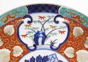 A late 20thC Japanese Imari charger, decorated with reserves of trees and prunus blossom, and... - 5
