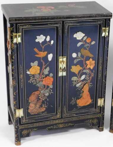 A Chinese black lacquer cabinet, of rectangular form, decorated with flowers, and overlaid in...