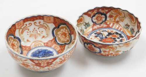 A Japanese Meiji period Imari porcelain bowl, of fluted form, decorated with reserves of hoho...