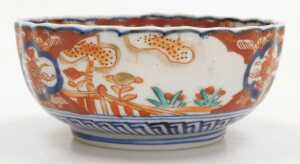 A Japanese Meiji period Imari porcelain bowl, of fluted form, decorated with reserves of hoho... - 2