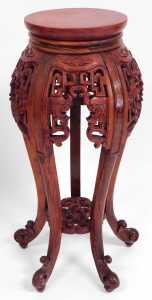 A pair of Chinese hardwood urn stands, stained red, each with a plain circular top, above... - 5