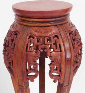 A pair of Chinese hardwood urn stands, stained red, each with a plain circular top, above... - 6