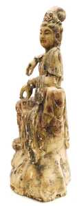 A Qing Dynasty 19thC Chinese wooden figure of Guanyin, modelled seated upon a rocky base,... - 2