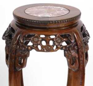A pair of Chinese hardwood urn stands, the circular top inset with red marble, above a prunus... - 6