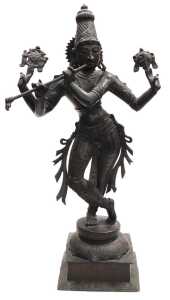 A 20thC bronze figure of Lord Krishna, modelled standing, in a cross legged pose, playing a...