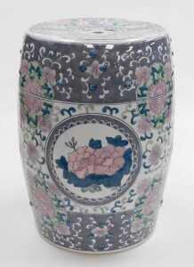 A late 20thC Chinese porcelain garden seat, of barrel form, decorated with reserves of flowers...
