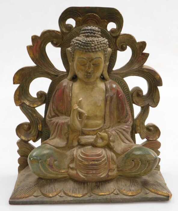 A 20thC Chinese carved wooden figure of Buddha, modelled seated in the lotus position, with a...