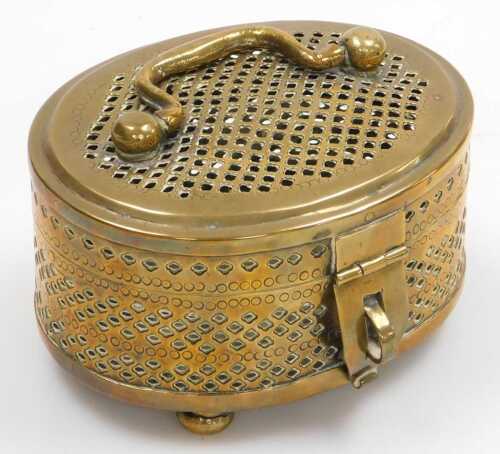 A 19thC Indian brass pandan box, of oval form, with handle to the lid, raised on four bun feet,...
