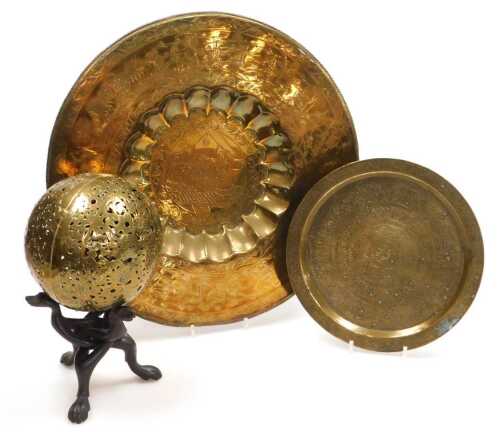 An early 20thC Indian brass charger, engraved centrally with a maharajah and maharani, within a...