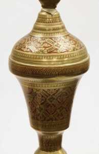 A 20thC Indian brass table lamp, highlighted in red and embossed with flowers, together with a... - 2