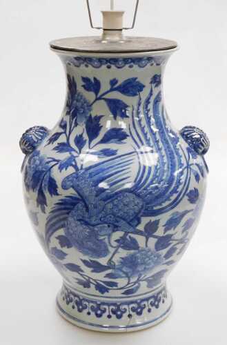 A Chinese Qing Dynasty 19thC blue and white porcelain vase, of baluster form, with butterfly and...