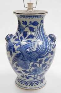 A Chinese Qing Dynasty 19thC blue and white porcelain vase, of baluster form, with butterfly and...