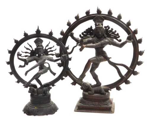 Two Indian bronze figures of Shiva Nataraja, modelled performing the Cosmic Dance within a fiery...