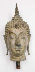 A 19thC Thai bronze bust of Buddha, cast with elongated ears, scrolling curls, and surmounted...