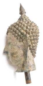 A 19thC Thai bronze bust of Buddha, cast with elongated ears, scrolling curls, and surmounted... - 2
