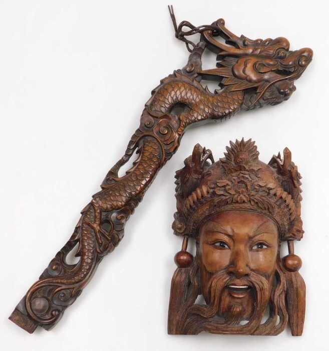An early 20thC Chinese carved hardwood standard lamp arm, carved as a dragon, 61cm high,...