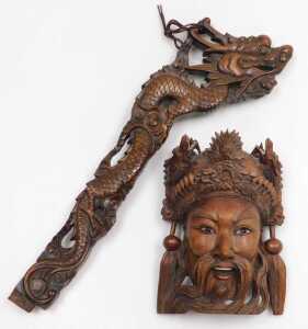An early 20thC Chinese carved hardwood standard lamp arm, carved as a dragon, 61cm high,...