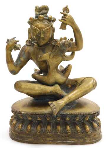 A 19thC Tibetan bronze figure of Mahasiddha Ghantapa and his consort, modelled in embrace,...