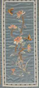 A late 19thC Chinese silk sleeve panel, embroidered with butterflies and flowers, 42cm x 22cm,... - 2