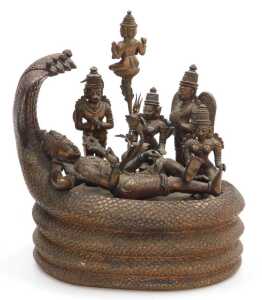 A 19thC Indian copper alloy figure group, depicting the Cosmic Sleep of Lord Vishnu, modelled... - 2