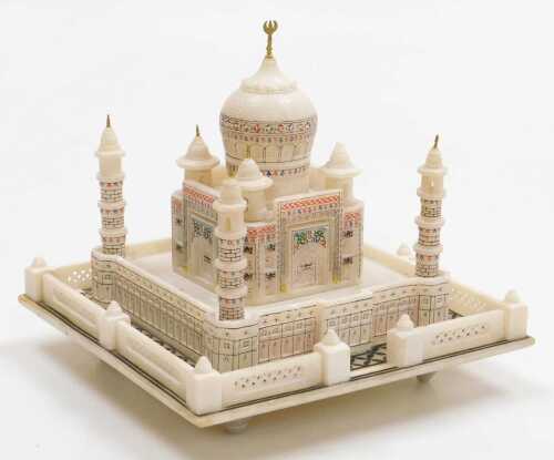 An Indian alabaster illuminated model of the Taj Mahal, 8.5cm high, 20.5cm wide.