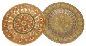 An early 20thC Indian brass and niello tray top, decorated centrally with reserves of figures...